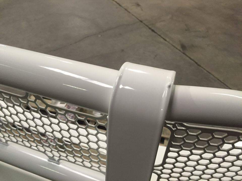white bumper section with honeycomb grille detail
