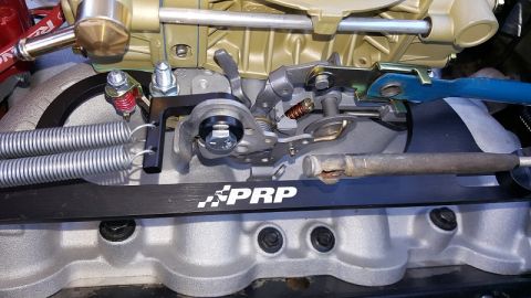 1978 Ford Bronco - Detail of aftermarket carburetor linkage, PRP branding and dual return springs.