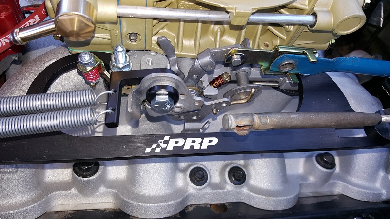Close-up of PRP carburetor linkage with dual springs