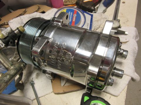chrome Sanden air conditioning compressor with part number C508-Z404 visible