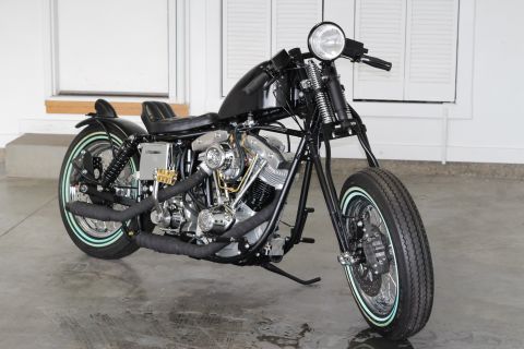 1975 Harley-Davidson FXRT Sport Glide - Custom motorcycle with a black fuel tank and dual exhaust pipes.