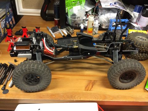 1989 Ford Bronco - This is a remote-controlled car chassis, not a 1989 Ford Bronco, with its suspension and large tires visible.
