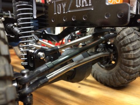 1989 Ford Bronco - Close-up of a remote control car's suspension system, showing intricate mechanical details.