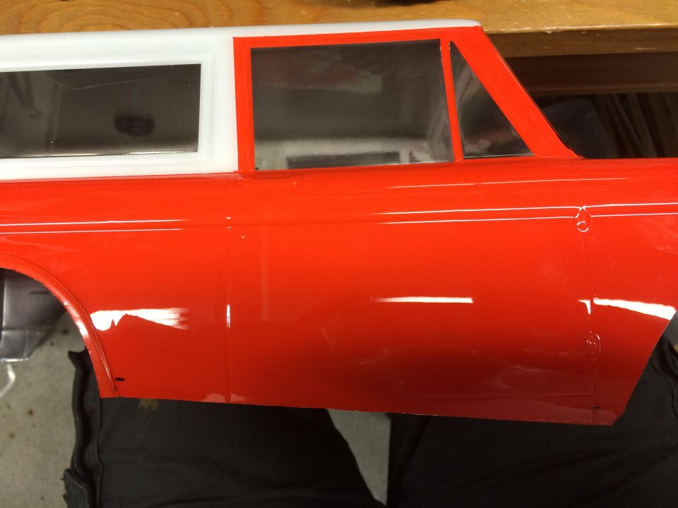 red and white RC car body, side view