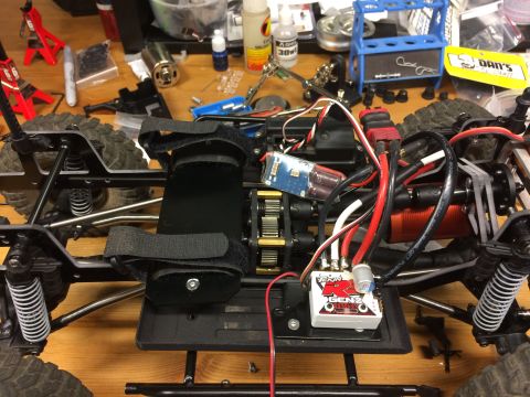 1989 Ford Bronco - RC car chassis with electronics installed, including motor and speed controller.