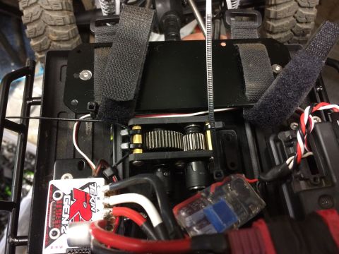 1989 Ford Bronco - The internal components of a remote-controlled vehicle, including its drivetrain and electronic speed controller.