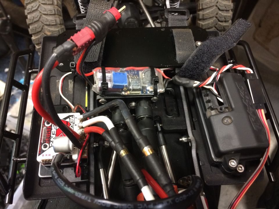 Remote control car interior with visible electronics, wires, and tires