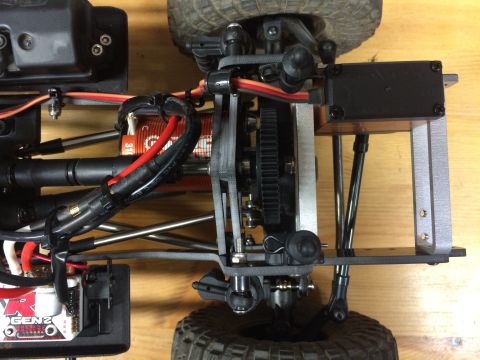 1989 Ford Bronco - The intricate mechanical details of a remote-controlled car's chassis are visible in this overhead shot.