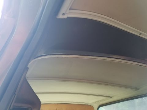 1979 Ford Bronco - Close-up view of the interior roof structure, showing the headliner and trim details.