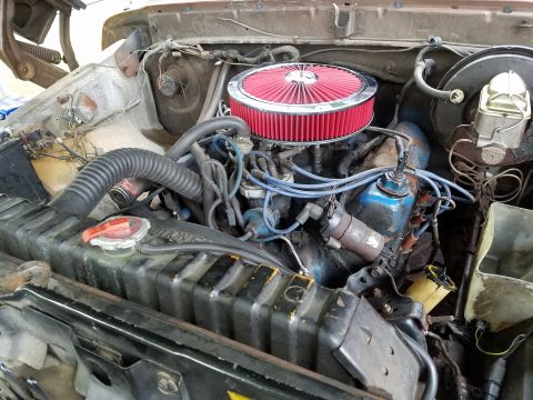1979 Ford Bronco - Close-up view of the engine compartment, showing various components and wiring.
