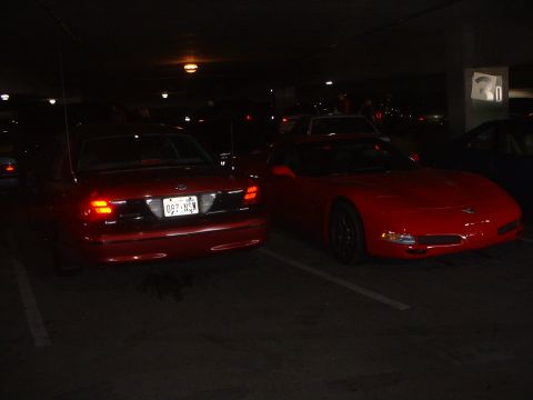 1999 Ford Crown Victoria - Z06 Corvett parked next to Big Red in the parking garage.