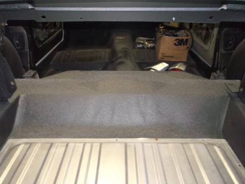 1967 Ford Mustang - The interior of a vehicle is shown, with the trunk area and rear seating area visible.