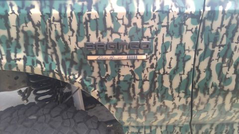 1991 Ford Bronco - The side panel of a Ford Bronco displays its model name and Eddie Bauer trim level.