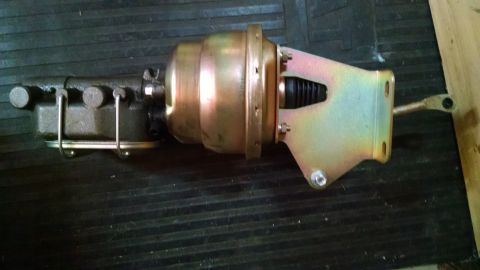 1985 Jeep CJ7 - A brake booster and master cylinder assembly is shown, likely a replacement part for a vehicle.