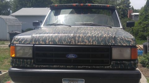 1991 Ford Bronco - This 1991 Ford Bronco is covered in a camouflage wrap, obscuring its original paint.