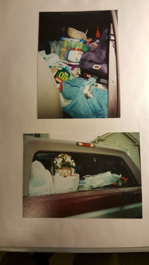 1996 Ford Bronco - Vehicle interior filled with various items, including groceries and blankets.