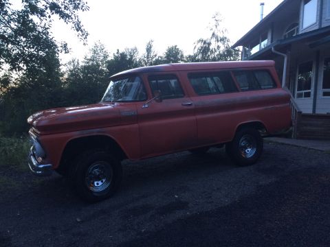 1962 Chevrolet Suburban - This Chevrolet Suburban shows a side profile with visible wear and tear on its paint.