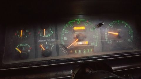 1988 Ford Bronco - Dashboard gauges of a 1988 Ford Bronco, showing speed, RPM, fuel level, and engine temperature.