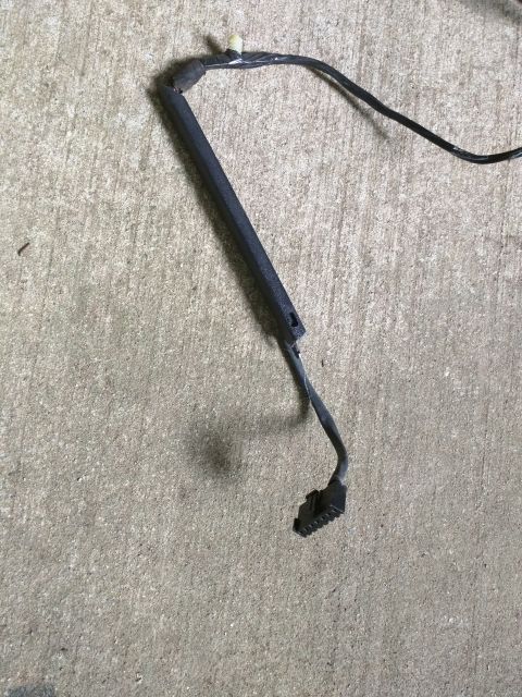 2007 Ford Crown Victoria - A black electrical harness with a multi-pin connector is shown lying on a concrete surface. The harness appears to be broken or detached fr…