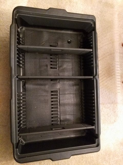 2007 Ford Crown Victoria - An empty black plastic organizer tray with multiple compartments and shelves is shown from a top-down perspective. The tray appears to be d…