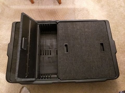 2007 Ford Crown Victoria - This is an image of an open black storage case with a gray felt interior. The case has a hinged lid on the left and a sliding cover on the…