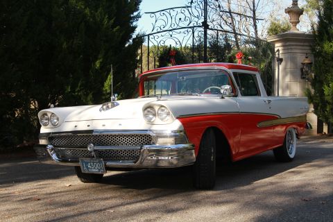 1958 Ford Ranchero - This two-tone red and white 1957 Ford Fairlane Ranchero is seen from a three-quarter front angle.