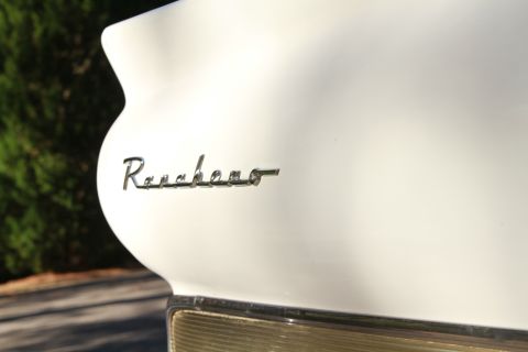 1958 Ford Ranchero - Close-up of the 'Ranchero' emblem on the rear quarter panel of a white 1958 Ford Ranchero.