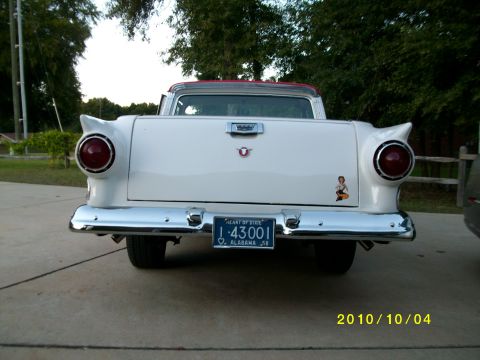 1958 Ford Ranchero - Rear view of a white 1957 Ford Fairlane Ranchero pickup truck with a red roof and distinctive tail fins.