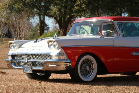 1958 Ford Ranchero - Two-tone 1958 Ford Ranchero with wire wheels parked outdoors.