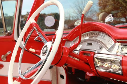 1958 Ford Ranchero - The dashboard and steering wheel of a classic car, showing its distinctive interior design.