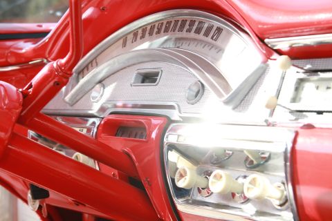 1958 Ford Ranchero - Close-up of the 1958 Ford Ranchero interior, focusing on the instrument cluster and radio.