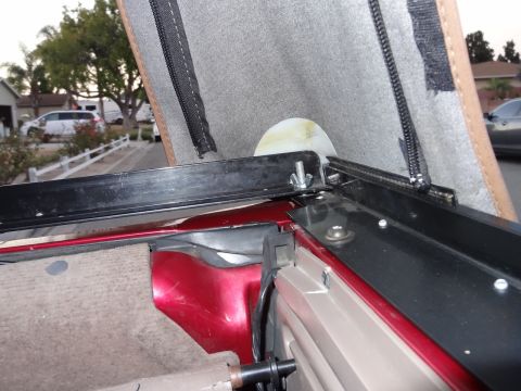 1994 Ford Bronco - Close-up of the soft top frame and interior of a 1994 Ford Bronco.
