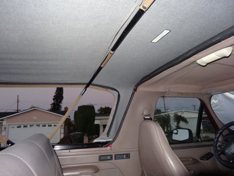 1994 Ford Bronco - Interior view of a 1994 Ford Bronco soft top, highlighting the headliner and the structure around the rear window.