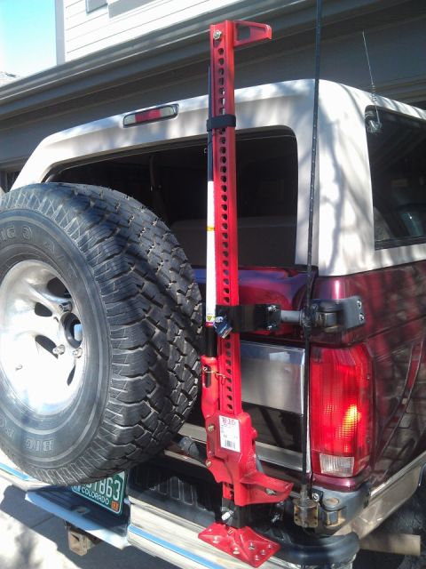1996 Ford Bronco - 1996 Ford Bronco rear view showing spare tire and a hi-lift jack attached to the carrier.