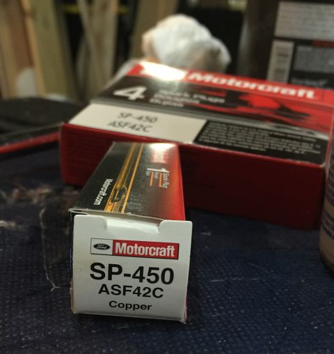 1978 Ford Bronco - A box of Motorcraft SP-450 ASF42C copper spark plugs is shown, with another box in the background.