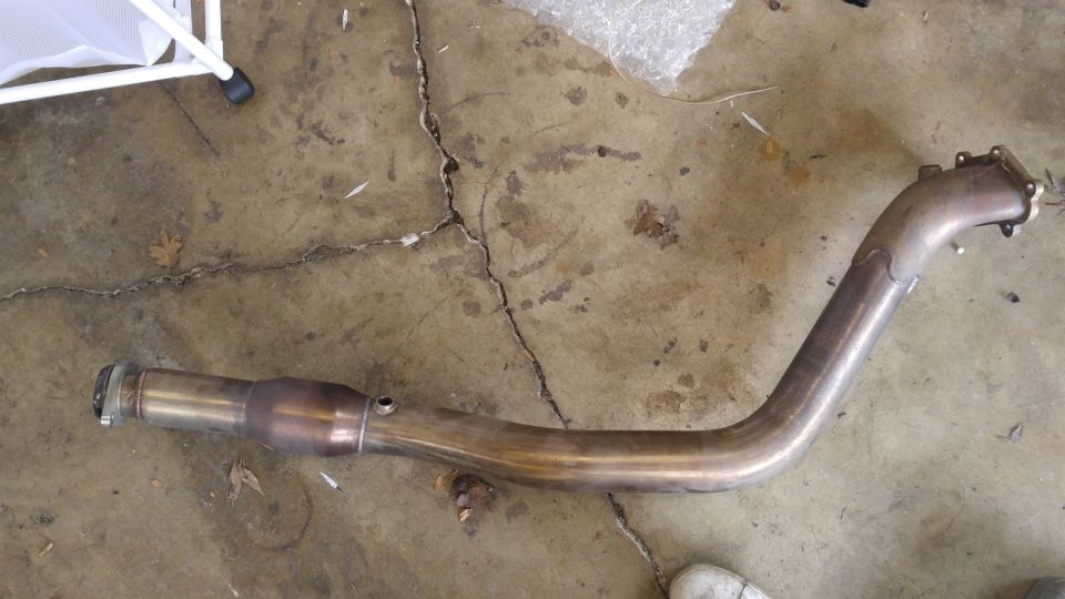 Exhaust pipe on a cracked concrete floor