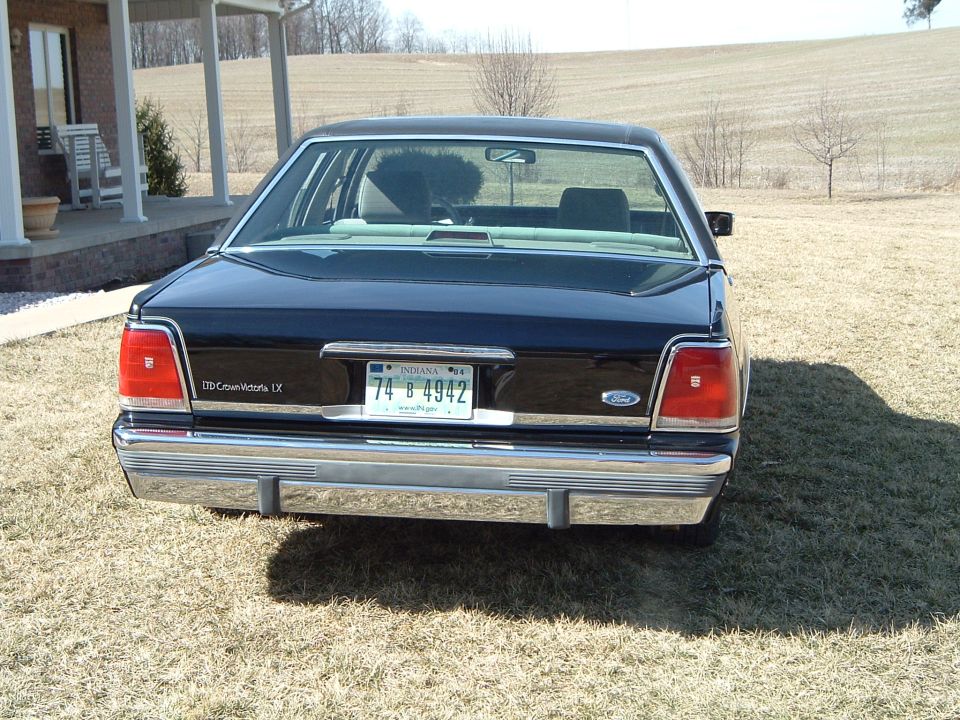 Rear of dark Ford LTD Crown Victoria LX sedan with Indiana plate 74 B 4942
