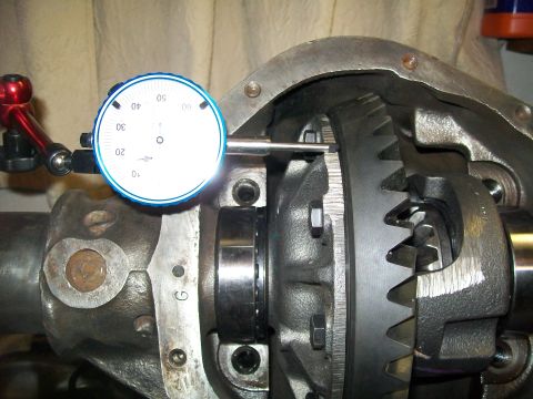 1991 Ford Bronco - A close-up view shows a differential with a dial indicator gauge set up to measure backlash. The gauge is mounted on a magnetic base and it…
