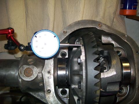 1991 Ford Bronco - A dial indicator is positioned to measure the backlash of a differential gear assembly. The assembly is mounted within a differential housi…