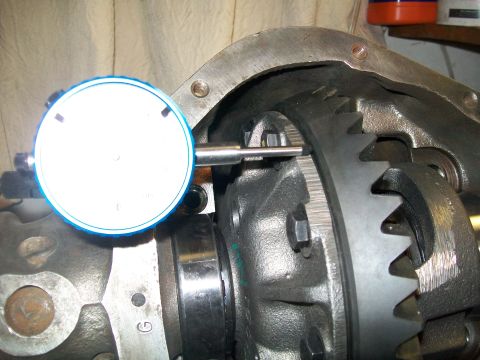 1991 Ford Bronco - A dial indicator is positioned against the teeth of a differential ring gear, likely measuring backlash during a gear setup in a Ford Bronc…