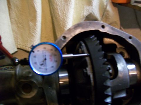 1991 Ford Bronco - A dial indicator is positioned to measure the backlash of a differential gear assembly, likely within a 1991 Ford Bronco.