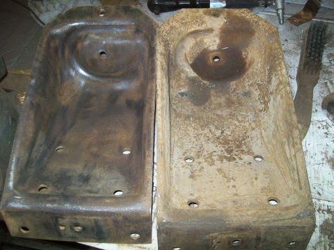 1991 Ford Bronco - Two heavily rusted metal parts, possibly from a vehicle's undercarriage, are shown side-by-side. The part on the left appears to have been…