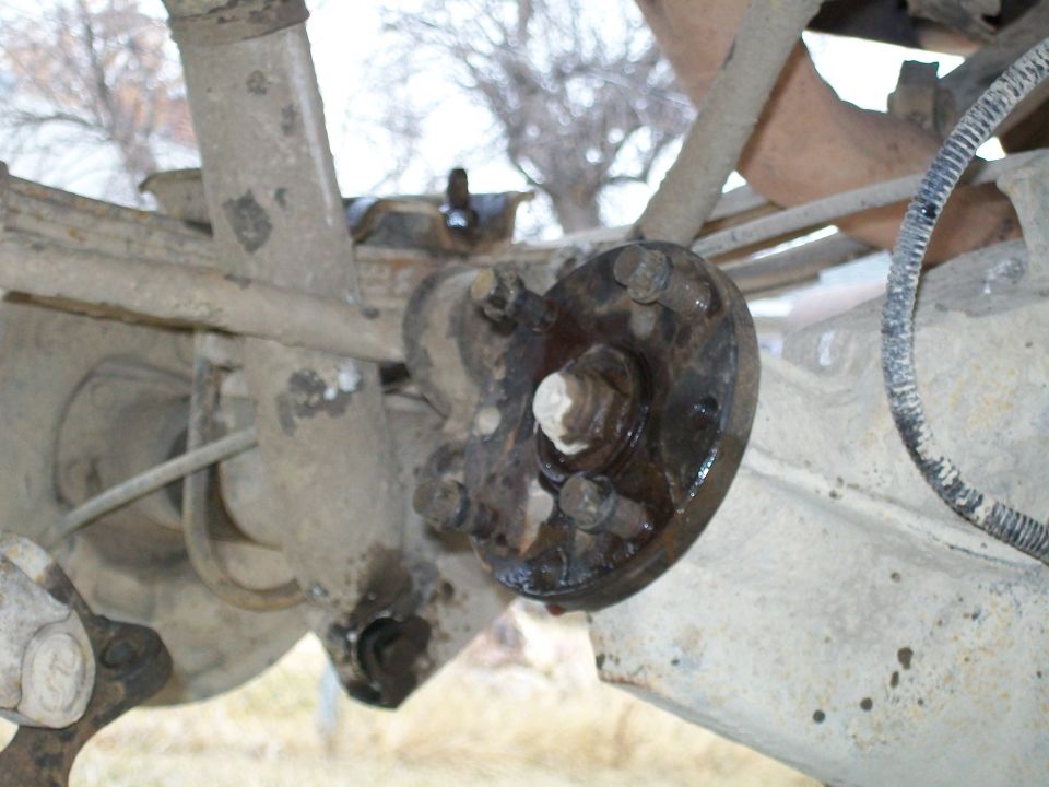 1991 Ford Bronco rear axle assembly with leaf spring and u-bolt plate.