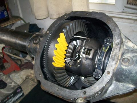 1991 Ford Bronco - The open differential housing of a 1991 Ford Bronco shows the ring gear with yellow marking compound applied to the teeth, indicating conta…
