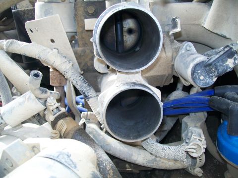 1991 Ford Bronco - Two large exhaust pipes are shown in this close-up view.