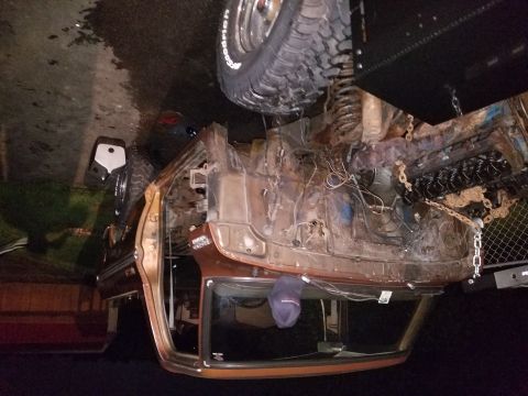 1979 Ford Bronco - Vehicle chassis undergoing restoration, showing extensive rust and engine components.