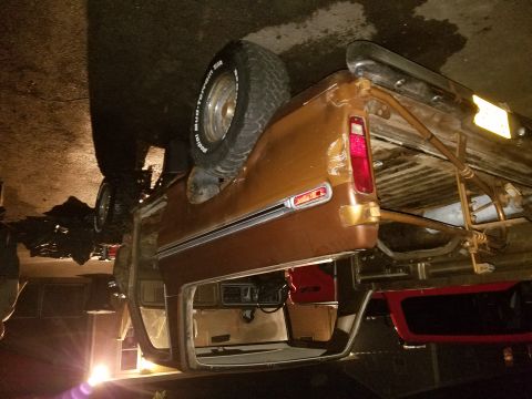 1979 Ford Bronco - This pickup truck appears to be from the 1970s and is resting on its side.