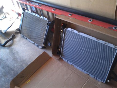 1996 Ford Bronco - Two vehicle radiators are shown, one still in its original packaging.