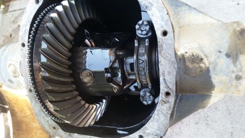 1992 Ford Bronco - Close-up of a vehicle differential, showing internal gears and a stamped yoke.
