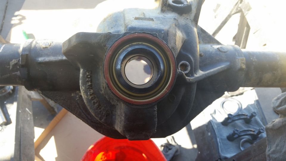 Differential housing with a red and yellow seal visible in the center opening